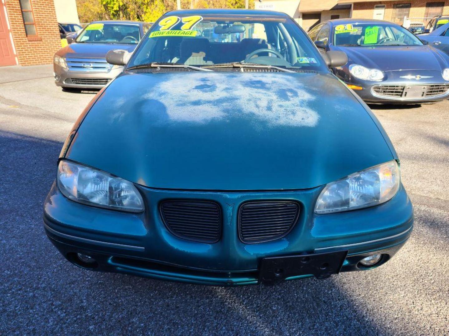 1998 GREEN PONTIAC GRAND AM SE (1G2NE52T4WM) with an 2.4L engine, Automatic transmission, located at 117 North Cameron Street, Harrisburg, PA, 17101, (717) 963-8962, 40.267021, -76.875351 - WE FINANCE!!! Good Credit/ Bad Credit/ No Credit - ALL Trade-Ins Welcomed!!! ***Guaranteed Credit Approval*** APPLY ONLINE or CALL us TODAY ;) Internet Prices and Marketplace Prices are SPECIAL discounted ***CASH DEALS*** Retail Prices are higher. Please call us to discuss your cash and finan - Photo#7