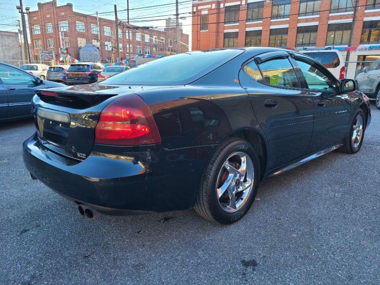 2004 BLACK PONTIAC GRAND PRIX GTP (2G2WR524741) with an 3.8L engine, Automatic transmission, located at 117 North Cameron Street, Harrisburg, PA, 17101, (717) 963-8962, 40.267021, -76.875351 - WE FINANCE!!! Good Credit/ Bad Credit/ No Credit - ALL Trade-Ins Welcomed!!! ***Guaranteed Credit Approval*** APPLY ONLINE or CALL us TODAY ;) Internet Prices and Marketplace Prices are SPECIAL discounted ***CASH DEALS*** Retail Prices are higher. Please call us to discuss your cash and finan - Photo#4