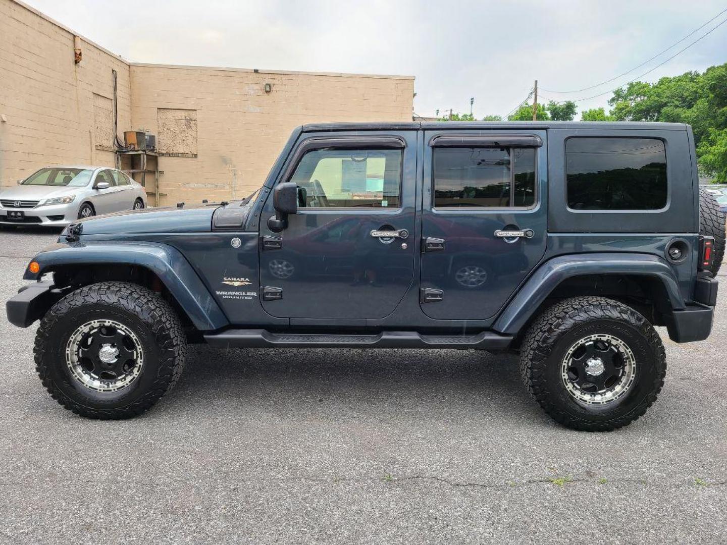 2008 BLUE JEEP WRANGLER UNLIMI SAHARA (1J4GA59118L) with an 3.8L engine, Automatic transmission, located at 117 North Cameron Street, Harrisburg, PA, 17101, (717) 963-8962, 40.267021, -76.875351 - WE FINANCE!!! Good Credit/ Bad Credit/ No Credit - ALL Trade-Ins Welcomed!!! ***Guaranteed Credit Approval*** APPLY ONLINE or CALL us TODAY ;) Internet Prices and Marketplace Prices are SPECIAL discounted ***CASH DEALS*** Retail Prices are higher. Please call us to discuss your cash and finan - Photo#1
