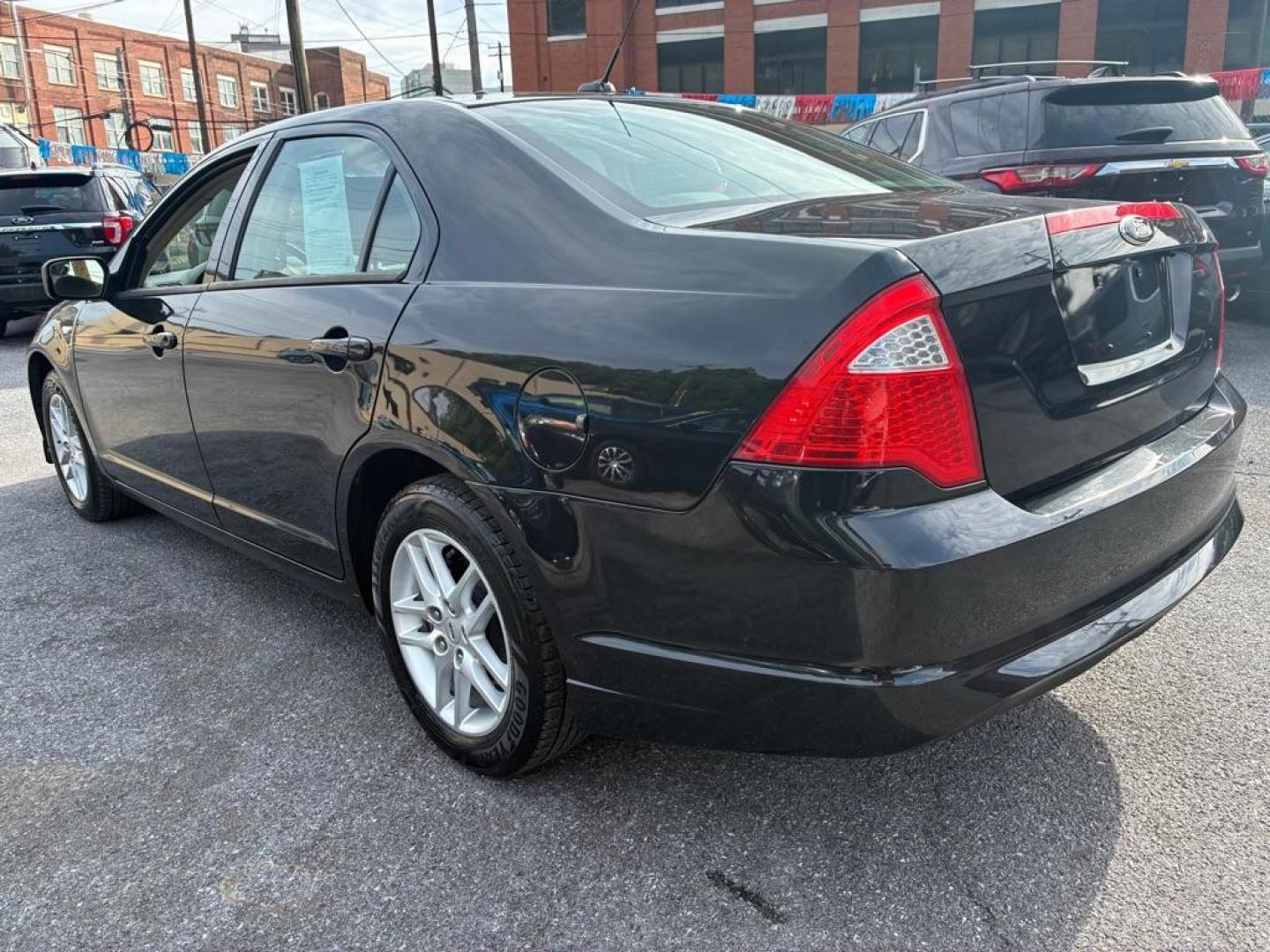2012 BLACK FORD FUSION S (3FAHP0GA1CR) with an 2.5L engine, Automatic transmission, located at 117 North Cameron Street, Harrisburg, PA, 17101, (717) 963-8962, 40.267021, -76.875351- Photo#2