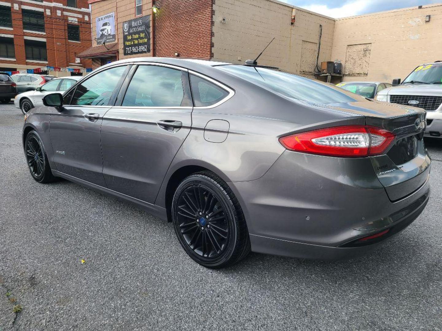 2013 GRAY FORD FUSION SE HYBRID (3FA6P0LU8DR) with an 2.0L engine, Continuously Variable transmission, located at 117 North Cameron Street, Harrisburg, PA, 17101, (717) 963-8962, 40.267021, -76.875351 - WE FINANCE!!! Good Credit/ Bad Credit/ No Credit - ALL Trade-Ins Welcomed!!! ***Guaranteed Credit Approval*** APPLY ONLINE or CALL us TODAY ;) Internet Prices and Marketplace Prices are SPECIAL discounted ***CASH DEALS*** Retail Prices are higher. Please call us to discuss your cash and finan - Photo#2