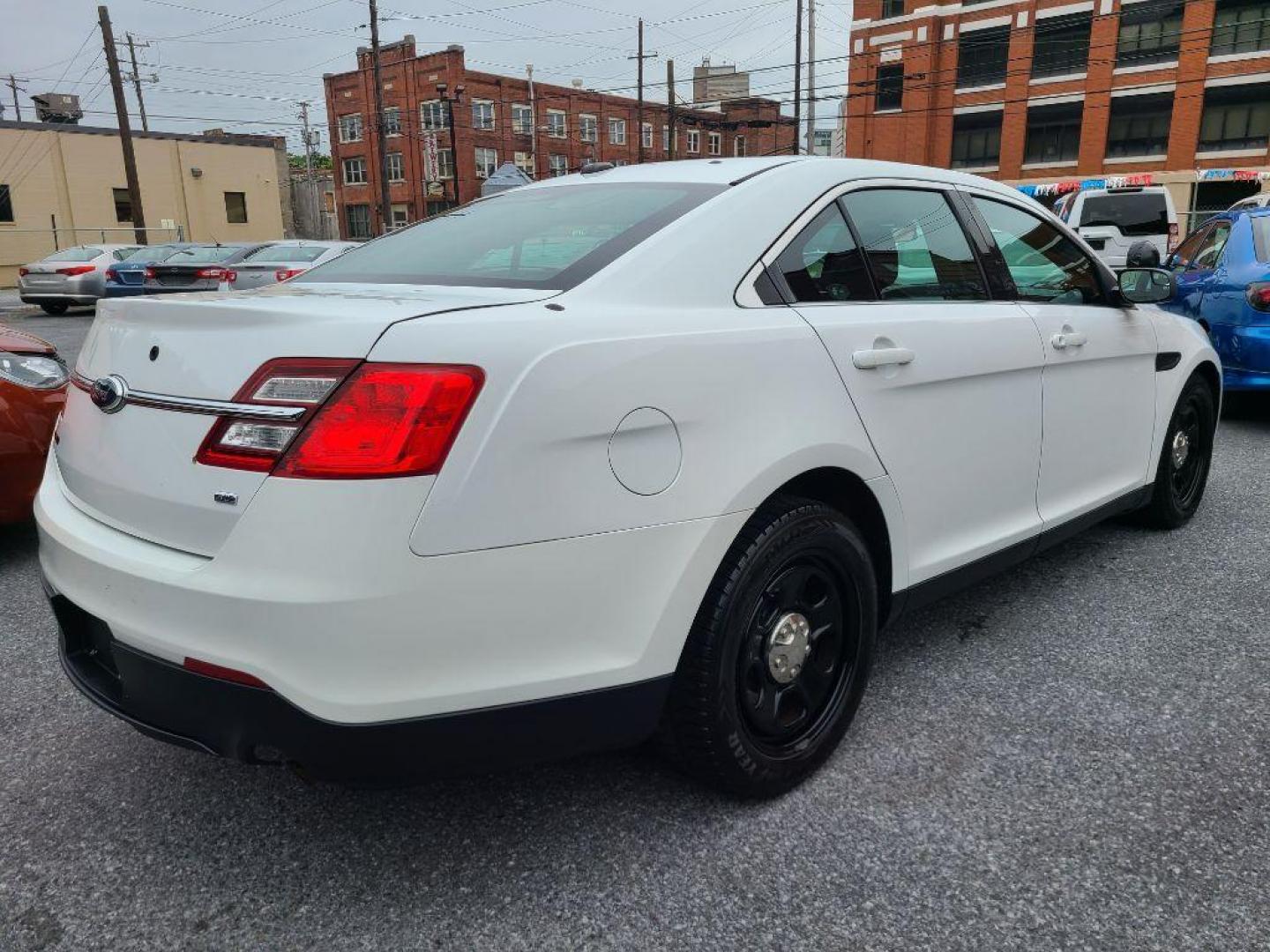 2013 WHITE FORD TAURUS POLICE INTERCEPTOR (1FAHP2MK8DG) with an 3.7L engine, Automatic transmission, located at 117 North Cameron Street, Harrisburg, PA, 17101, (717) 963-8962, 40.267021, -76.875351 - WE FINANCE!!! Good Credit/ Bad Credit/ No Credit - ALL Trade-Ins Welcomed!!! ***Guaranteed Credit Approval*** APPLY ONLINE or CALL us TODAY ;) Internet Prices and Marketplace Prices are SPECIAL discounted ***CASH DEALS*** Retail Prices are higher. Please call us to discuss your cash and finan - Photo#4