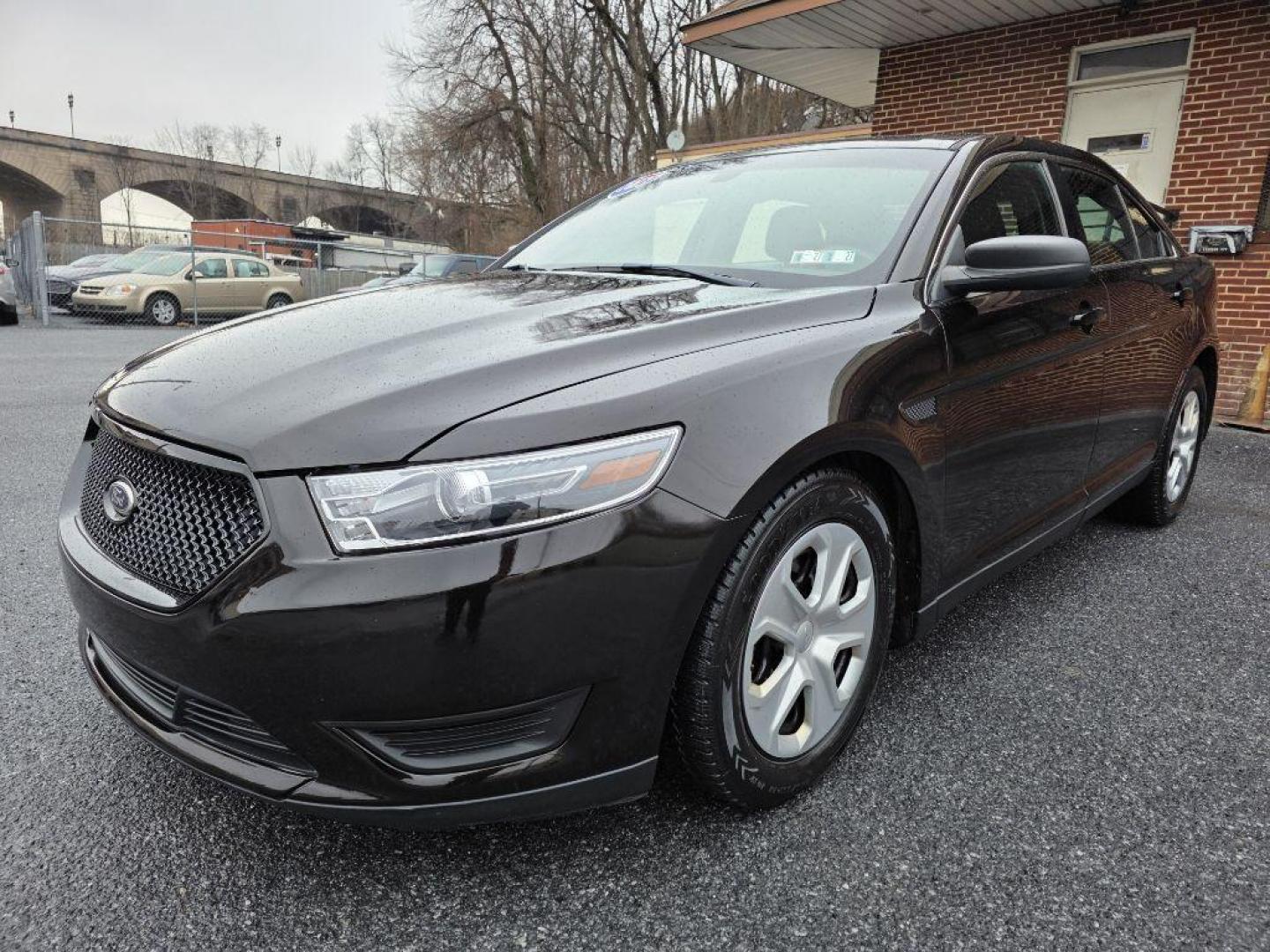 2013 BROWN FORD TAURUS POLICE INTERCEPTOR (1FAHP2MKXDG) with an 3.7L engine, Automatic transmission, located at 117 North Cameron Street, Harrisburg, PA, 17101, (717) 963-8962, 40.267021, -76.875351 - WE FINANCE!!! Good Credit/ Bad Credit/ No Credit - ALL Trade-Ins Welcomed!!! ***Guaranteed Credit Approval*** APPLY ONLINE or CALL us TODAY ;) Please call us to discuss your cash and financing options. - Photo#0