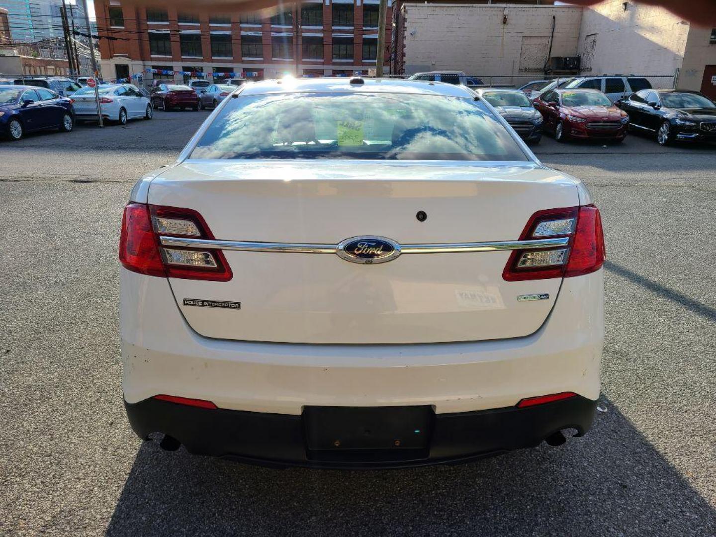 2014 WHITE FORD TAURUS POLICE INTERCEPTOR (1FAHP2MK5EG) with an 3.7L engine, Automatic transmission, located at 117 North Cameron Street, Harrisburg, PA, 17101, (717) 963-8962, 40.267021, -76.875351 - WE FINANCE!!! Good Credit/ Bad Credit/ No Credit - ALL Trade-Ins Welcomed!!! ***Guaranteed Credit Approval*** APPLY ONLINE or CALL us TODAY ;) Please call us to discuss your cash and financing options. - Photo#3