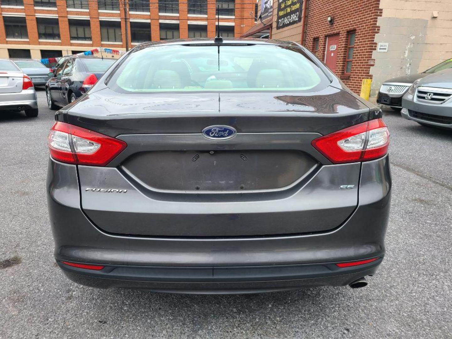 2015 GRAY FORD FUSION SE (1FA6P0H76F5) with an 2.5L engine, Automatic transmission, located at 117 North Cameron Street, Harrisburg, PA, 17101, (717) 963-8962, 40.267021, -76.875351 - WE FINANCE!!! Good Credit/ Bad Credit/ No Credit - ALL Trade-Ins Welcomed!!! ***Guaranteed Credit Approval*** APPLY ONLINE or CALL us TODAY ;) Internet Prices and Marketplace Prices are SPECIAL discounted ***CASH DEALS*** Retail Prices are higher. Please call us to discuss your cash and finan - Photo#3