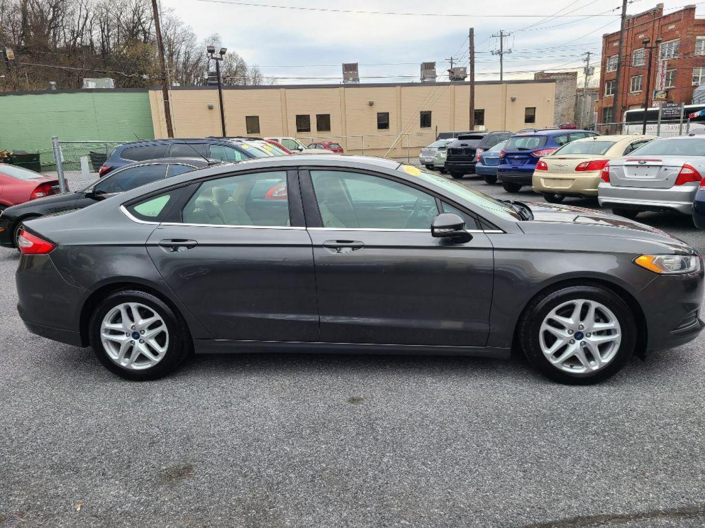 2015 GRAY FORD FUSION SE (1FA6P0H76F5) with an 2.5L engine, Automatic transmission, located at 117 North Cameron Street, Harrisburg, PA, 17101, (717) 963-8962, 40.267021, -76.875351 - WE FINANCE!!! Good Credit/ Bad Credit/ No Credit - ALL Trade-Ins Welcomed!!! ***Guaranteed Credit Approval*** APPLY ONLINE or CALL us TODAY ;) Internet Prices and Marketplace Prices are SPECIAL discounted ***CASH DEALS*** Retail Prices are higher. Please call us to discuss your cash and finan - Photo#5