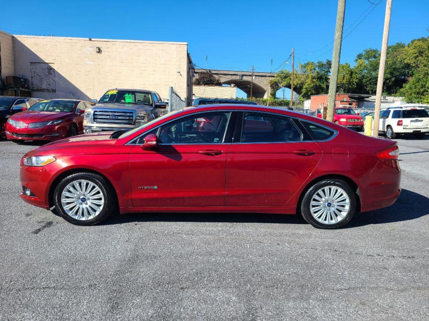 2015 RED FORD FUSION SE HYBRID (3FA6P0LU9FR) with an 2.0L engine, Continuously Variable transmission, located at 117 North Cameron Street, Harrisburg, PA, 17101, (717) 963-8962, 40.267021, -76.875351 - WE FINANCE!!! Good Credit/ Bad Credit/ No Credit - ALL Trade-Ins Welcomed!!! ***Guaranteed Credit Approval*** APPLY ONLINE or CALL us TODAY ;) Please call us to discuss your cash and financing options. - Photo#1