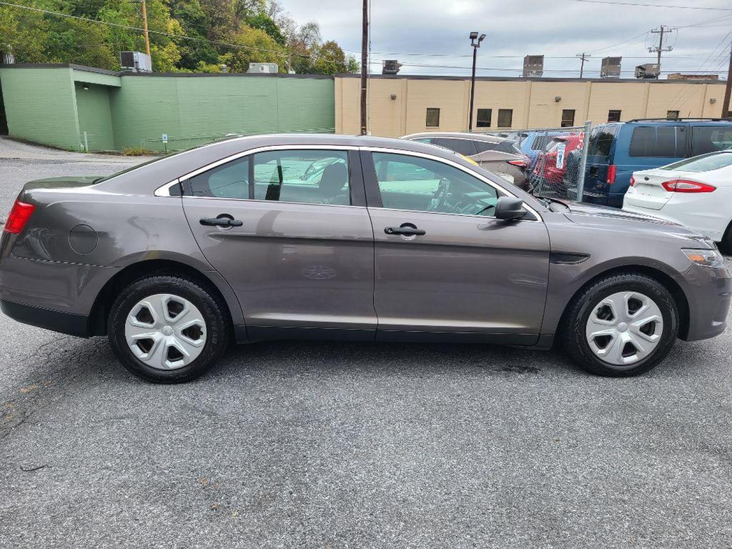 2015 GRAY FORD TAURUS POLICE INTERCEPTOR (1FAHP2MK4FG) with an 3.7L engine, Automatic transmission, located at 117 North Cameron Street, Harrisburg, PA, 17101, (717) 963-8962, 40.267021, -76.875351 - WE FINANCE!!! Good Credit/ Bad Credit/ No Credit - ALL Trade-Ins Welcomed!!! ***Guaranteed Credit Approval*** APPLY ONLINE or CALL us TODAY ;) Please call us to discuss your cash and financing options. - Photo#1