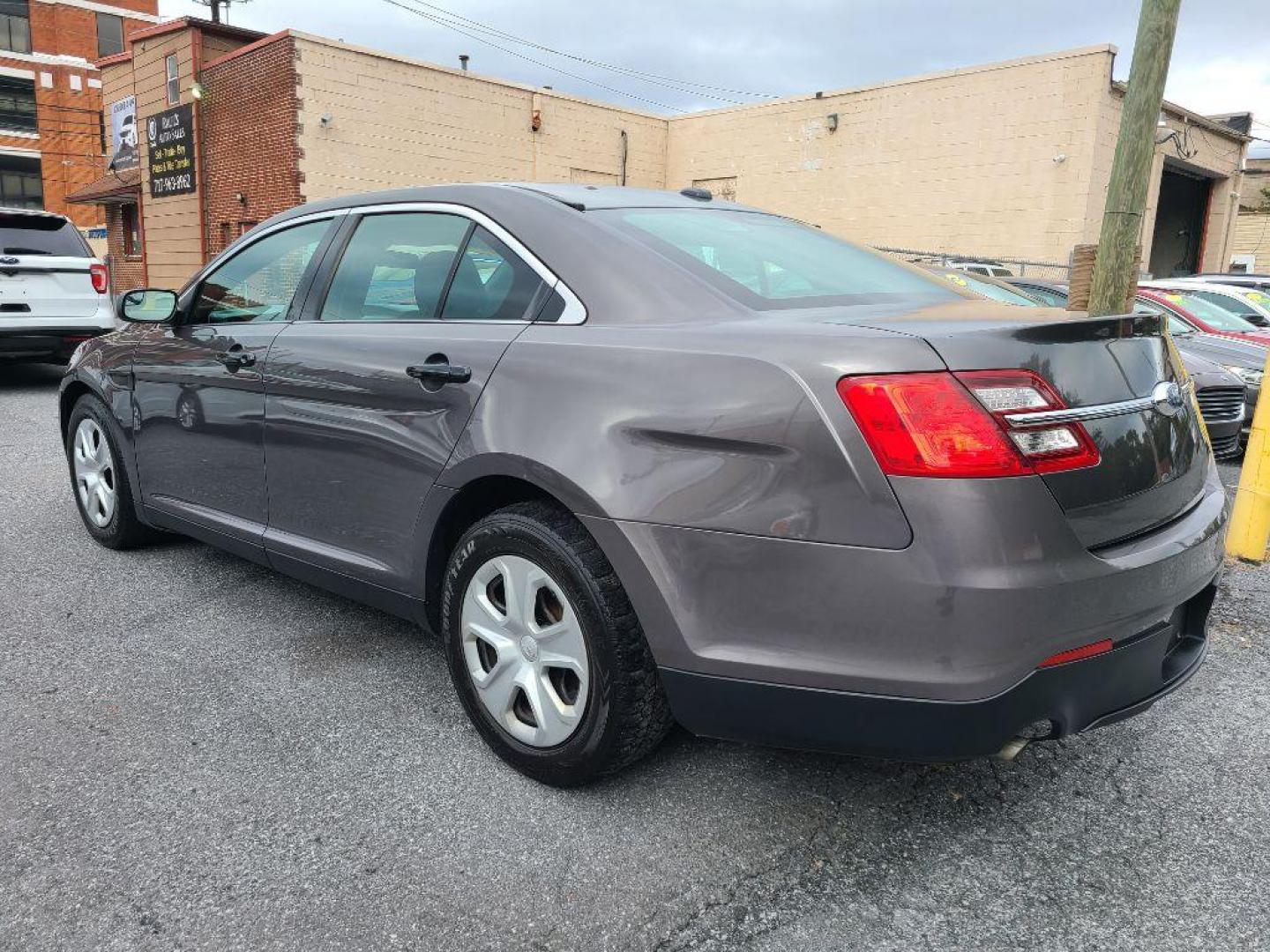 2015 GRAY FORD TAURUS POLICE INTERCEPTOR (1FAHP2MK4FG) with an 3.7L engine, Automatic transmission, located at 117 North Cameron Street, Harrisburg, PA, 17101, (717) 963-8962, 40.267021, -76.875351 - WE FINANCE!!! Good Credit/ Bad Credit/ No Credit - ALL Trade-Ins Welcomed!!! ***Guaranteed Credit Approval*** APPLY ONLINE or CALL us TODAY ;) Please call us to discuss your cash and financing options. - Photo#3