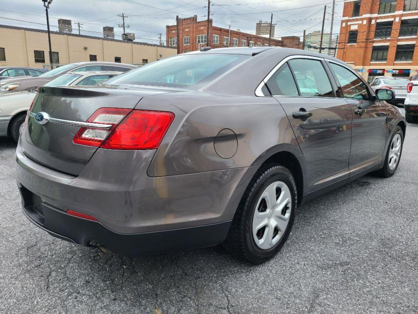 2015 GRAY FORD TAURUS POLICE INTERCEPTOR (1FAHP2MK4FG) with an 3.7L engine, Automatic transmission, located at 117 North Cameron Street, Harrisburg, PA, 17101, (717) 963-8962, 40.267021, -76.875351 - WE FINANCE!!! Good Credit/ Bad Credit/ No Credit - ALL Trade-Ins Welcomed!!! ***Guaranteed Credit Approval*** APPLY ONLINE or CALL us TODAY ;) Please call us to discuss your cash and financing options. - Photo#5