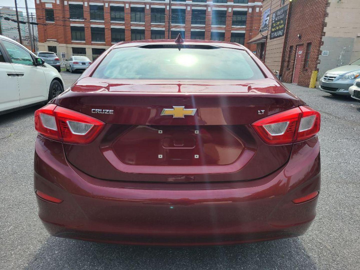2016 RED CHEVROLET CRUZE LT (1G1BE5SM0G7) with an 1.4L engine, Automatic transmission, located at 7981 Paxton Street, Harrisburg, PA, 17111, (717) 561-2926, 40.261490, -76.749229 - Photo#4