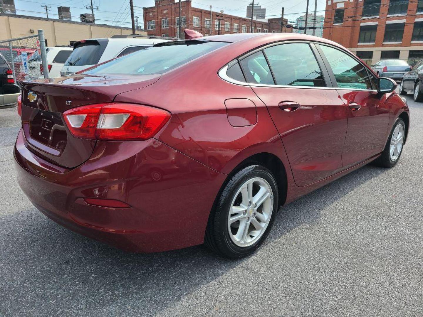 2016 RED CHEVROLET CRUZE LT (1G1BE5SM0G7) with an 1.4L engine, Automatic transmission, located at 7981 Paxton Street, Harrisburg, PA, 17111, (717) 561-2926, 40.261490, -76.749229 - Photo#5