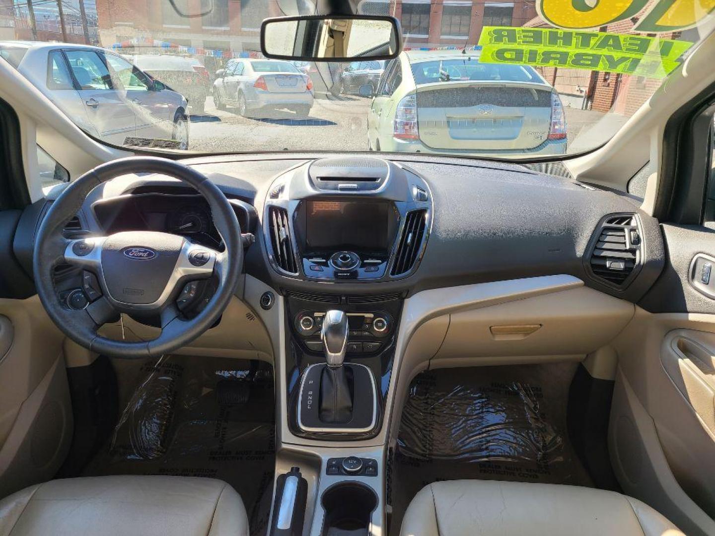 2016 TAN FORD C-MAX PREMIUM SEL (1FADP5CU9GL) with an 2.0L engine, Continuously Variable transmission, located at 7981 Paxton Street, Harrisburg, PA, 17111, (717) 561-2926, 40.261490, -76.749229 - WE FINANCE!!! Good Credit/ Bad Credit/ No Credit - ALL Trade-Ins Welcomed!!! ***Guaranteed Credit Approval*** APPLY ONLINE or CALL us TODAY ;) Internet Prices and Marketplace Prices are SPECIAL discounted ***CASH DEALS*** Retail Prices are higher. Please call us to discuss your cash and finan - Photo#12