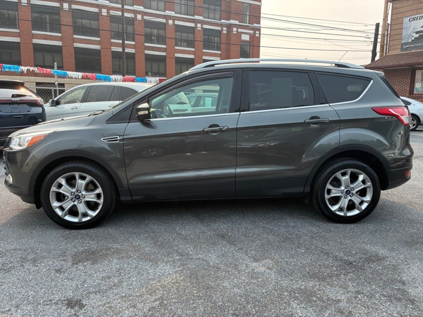 2016 GREY FORD ESCAPE TITANIUM (1FMCU9J9XGU) with an 2.0L engine, Automatic transmission, located at 117 North Cameron Street, Harrisburg, PA, 17101, (717) 963-8962, 40.267021, -76.875351- Photo#1