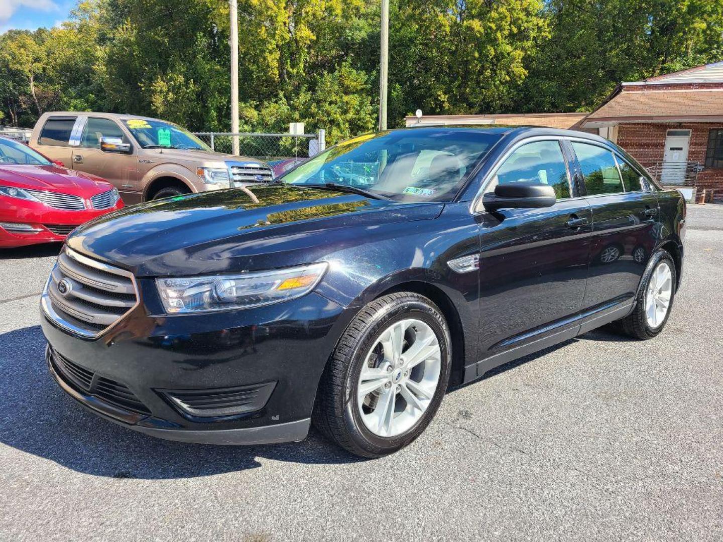 2016 BLACK FORD TAURUS SE (1FAHP2D8XGG) with an 3.5L engine, Automatic transmission, located at 117 North Cameron Street, Harrisburg, PA, 17101, (717) 963-8962, 40.267021, -76.875351 - Photo#0