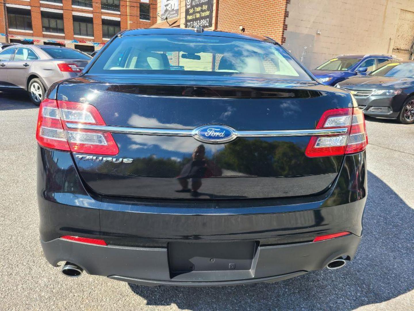 2016 BLACK FORD TAURUS SE (1FAHP2D8XGG) with an 3.5L engine, Automatic transmission, located at 117 North Cameron Street, Harrisburg, PA, 17101, (717) 963-8962, 40.267021, -76.875351 - Photo#3
