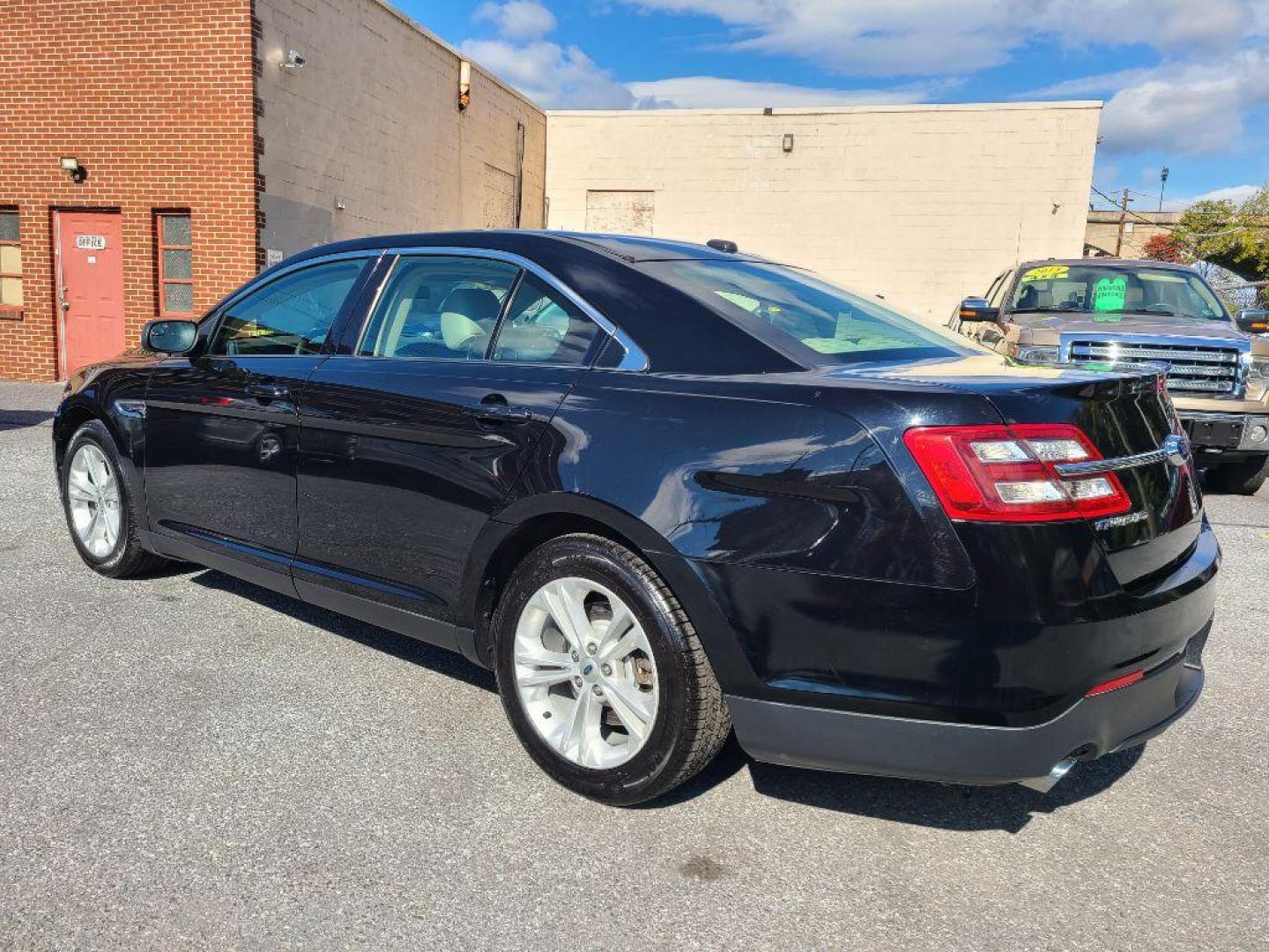 2016 BLACK FORD TAURUS SE (1FAHP2D8XGG) with an 3.5L engine, Automatic transmission, located at 117 North Cameron Street, Harrisburg, PA, 17101, (717) 963-8962, 40.267021, -76.875351 - Photo#2