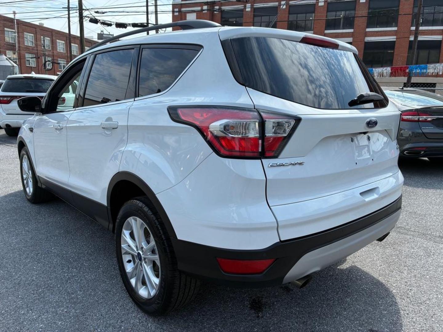 2017 WHITE FORD ESCAPE SE (1FMCU0GD7HU) with an 1.5L engine, Automatic transmission, located at 117 North Cameron Street, Harrisburg, PA, 17101, (717) 963-8962, 40.267021, -76.875351- Photo#2