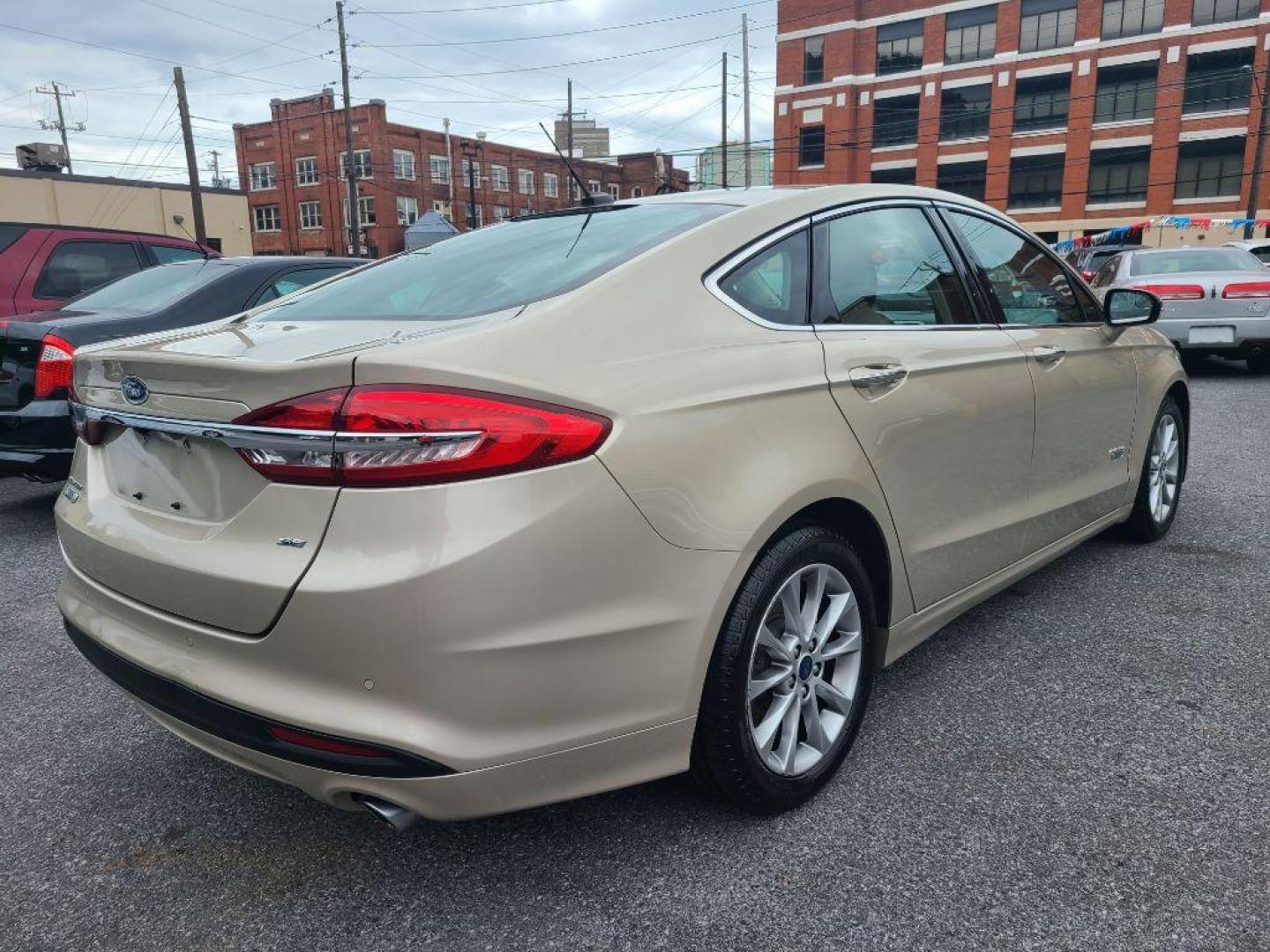 2017 TAN FORD FUSION SE PHEV (3FA6P0PU2HR) with an 2.0L engine, Continuously Variable transmission, located at 117 North Cameron Street, Harrisburg, PA, 17101, (717) 963-8962, 40.267021, -76.875351 - Photo#4