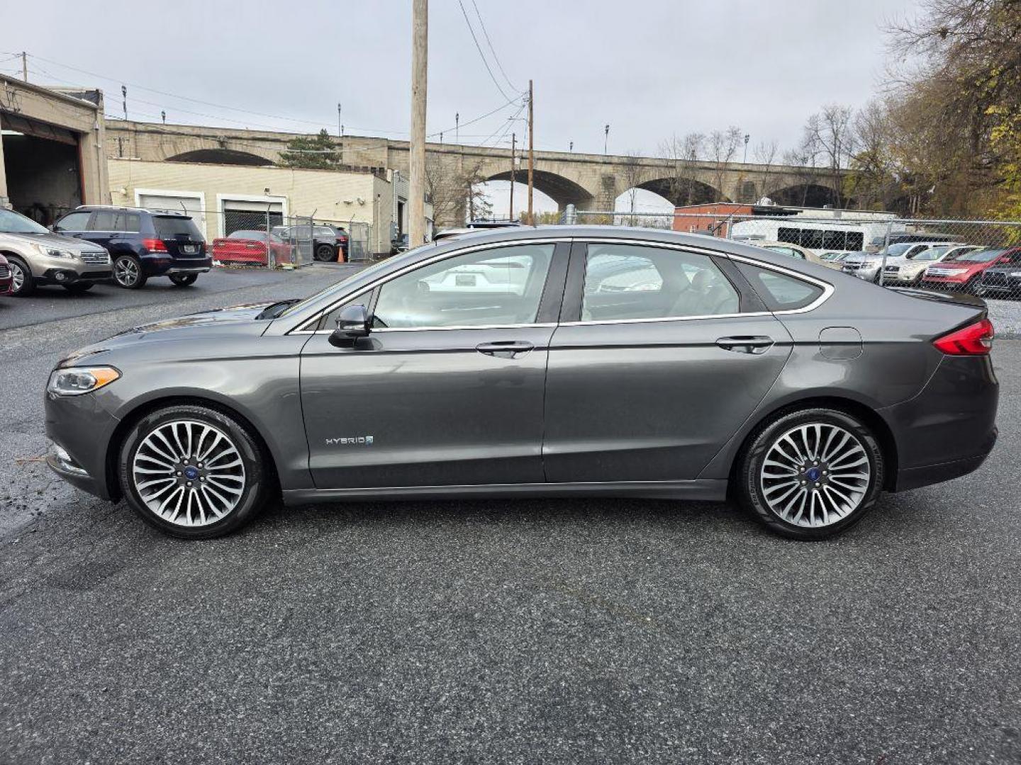 2017 GRAY FORD FUSION TITANIUM HEV (3FA6P0RU8HR) with an 2.0L engine, Continuously Variable transmission, located at 117 North Cameron Street, Harrisburg, PA, 17101, (717) 963-8962, 40.267021, -76.875351 - WE FINANCE!!! Good Credit/ Bad Credit/ No Credit - ALL Trade-Ins Welcomed!!! ***Guaranteed Credit Approval*** APPLY ONLINE or CALL us TODAY ;) Please call us to discuss your cash and financing options. - Photo#1