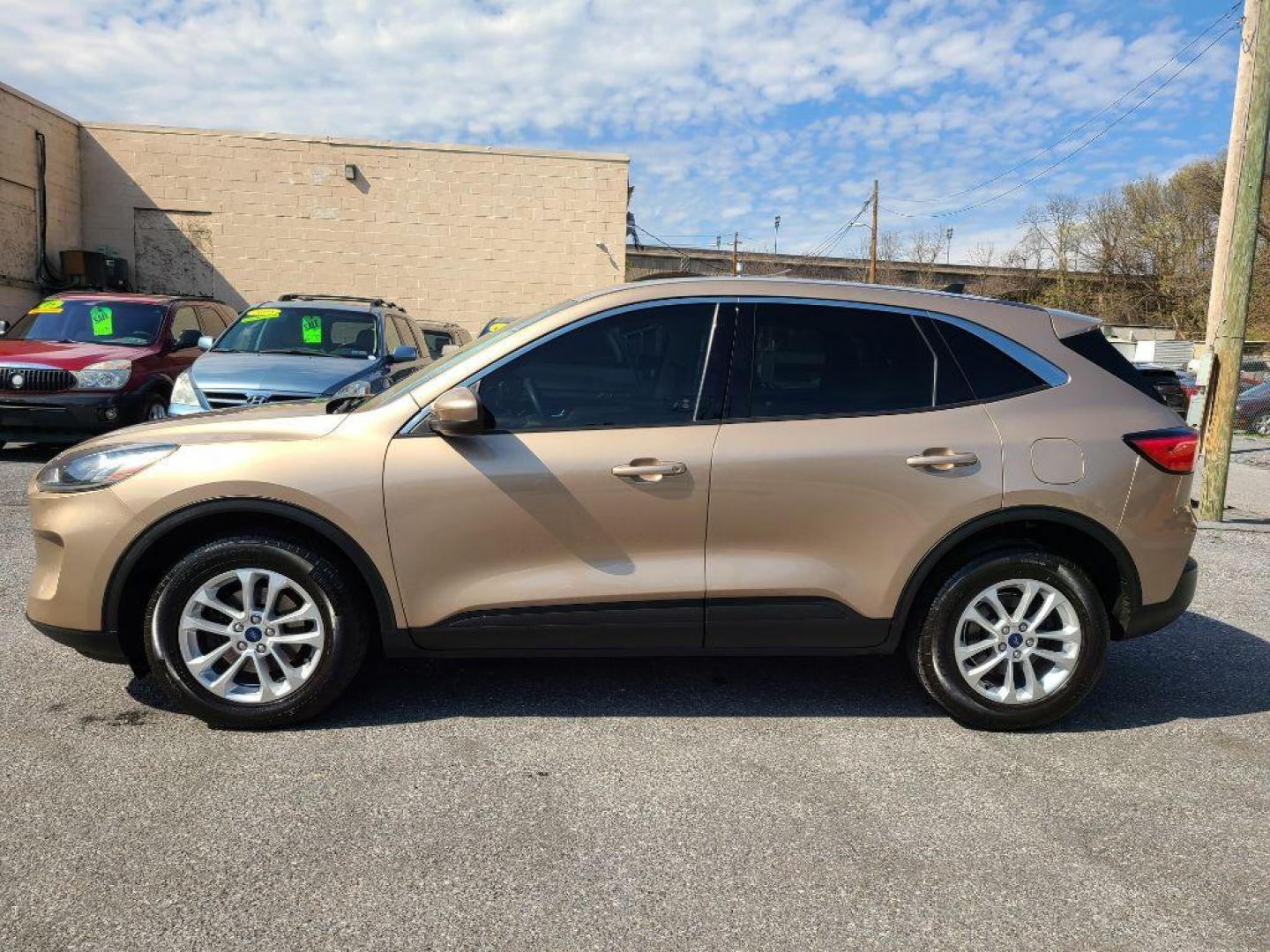 2020 TAN FORD ESCAPE SE (1FMCU9G64LU) with an 1.5L engine, Automatic transmission, located at 7981 Paxton Street, Harrisburg, PA, 17111, (717) 561-2926, 40.261490, -76.749229 - Photo#1